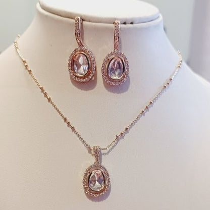 Kundan Jaina Pendant Set in Oval Shape with American Diamonds Lining and matching Earrings