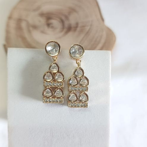 Gold Jigna Kundan Drop earrings with carat plating on Brass. Beautiful Jarokha design 